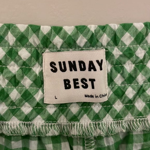 A pair of Kelly green and white gingham patterned shorts. - Picture 3 of 4